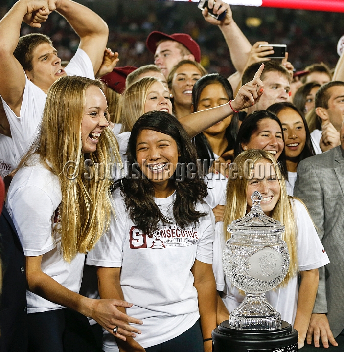 2013-Stanford-Oregon-040.JPG - Nov. 7, 2013; Stanford, CA, USA; Stanford Cardinal athletes      surround the Learfield Sports Directors Cup, won for the nineteenth straight year, during halftime against the Oregon Ducks at Stanford Stadium. Stanford defeated Oregon 26-20.